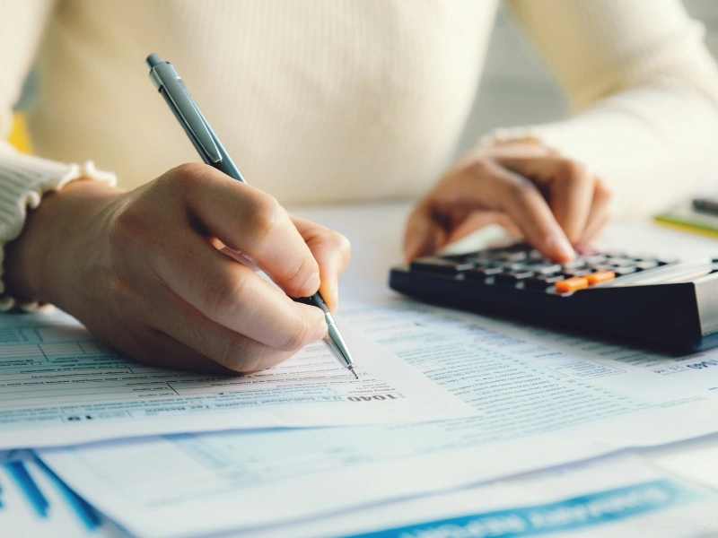 a small business owner filing taxes, highlighting how to file a tax extension.