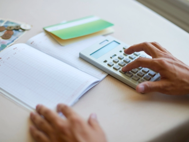 calculator and financial statement. Image accompanies the blog addressing what is a general ledger, general ledger, general ledger in accounting, importance of general ledger, general ledger accounting