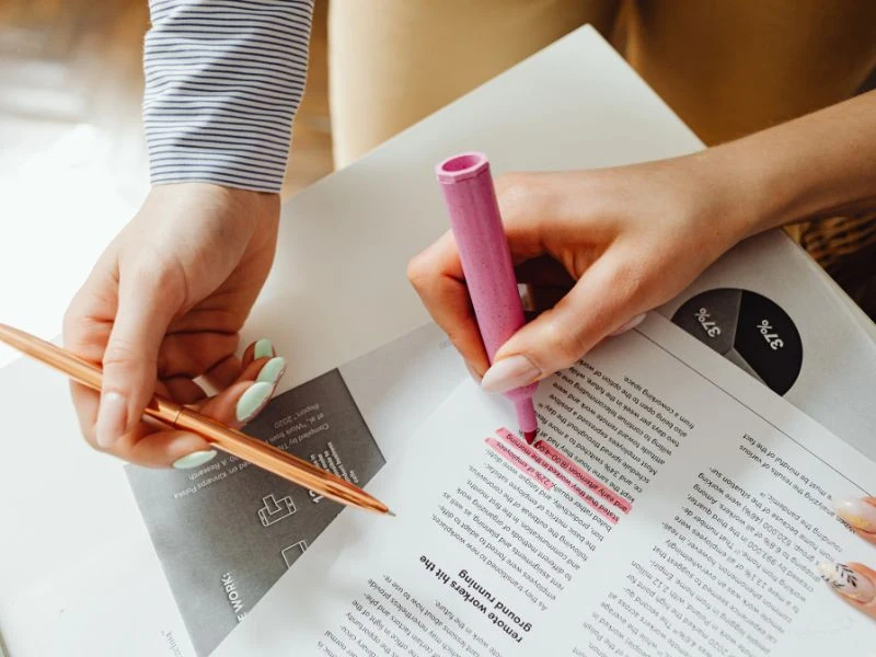 Two people reviewing documents and addressing "do roth conversions affect social security"