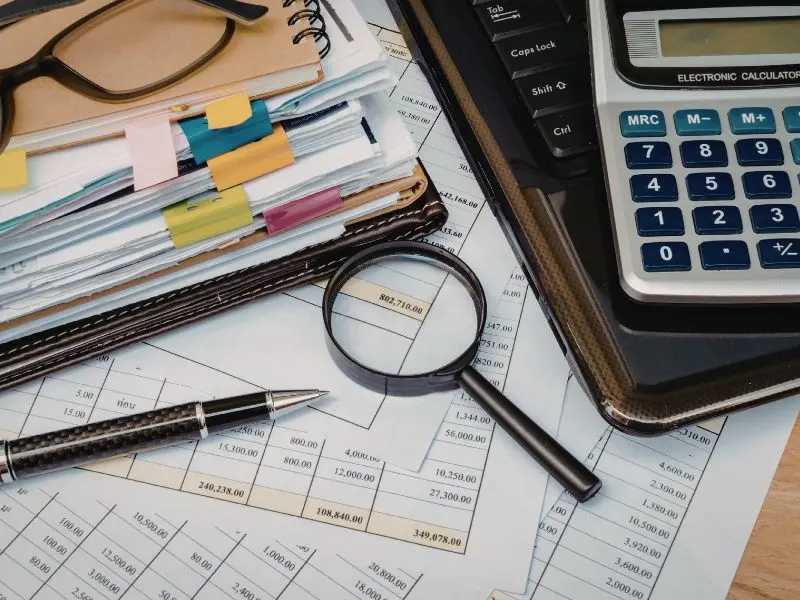 Magnifying glass on paper, addressing "do you pay social security tax on roth conversion"