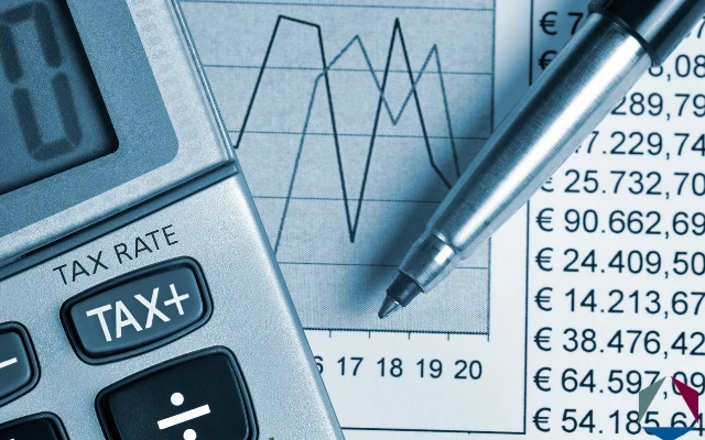 A pen, line graph, and calculator. This photo is meant to accompany the blog post titled Beneficial Ownership Information (BOI) Reporting. 