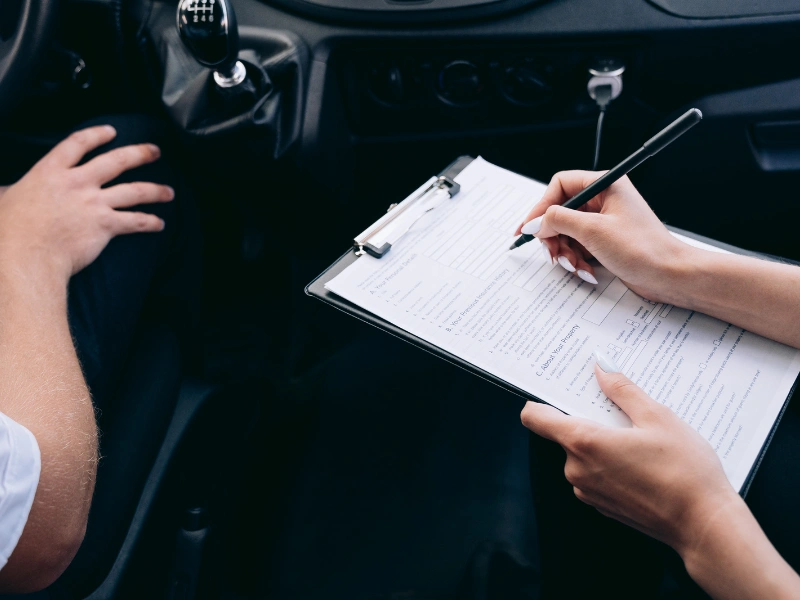 Clipboard with vehicle registration form. Image complements the blog post regarding irs standard mileage rate 2026 business.