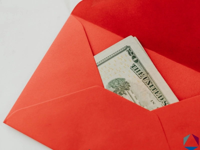 A red envelope with two 20 dollar bills. How much can you inherit from a trust without paying taxes in NC? 