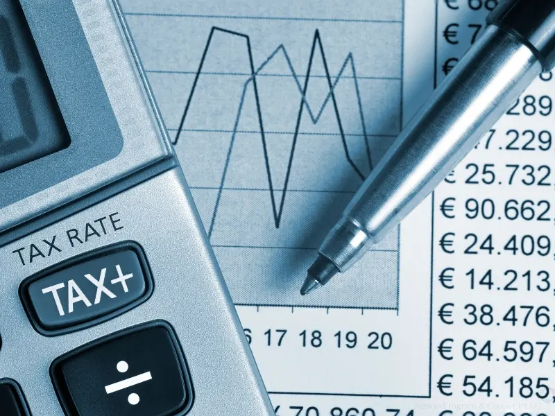 Detail of calculator, focusing on the tax key. no tax on tips.