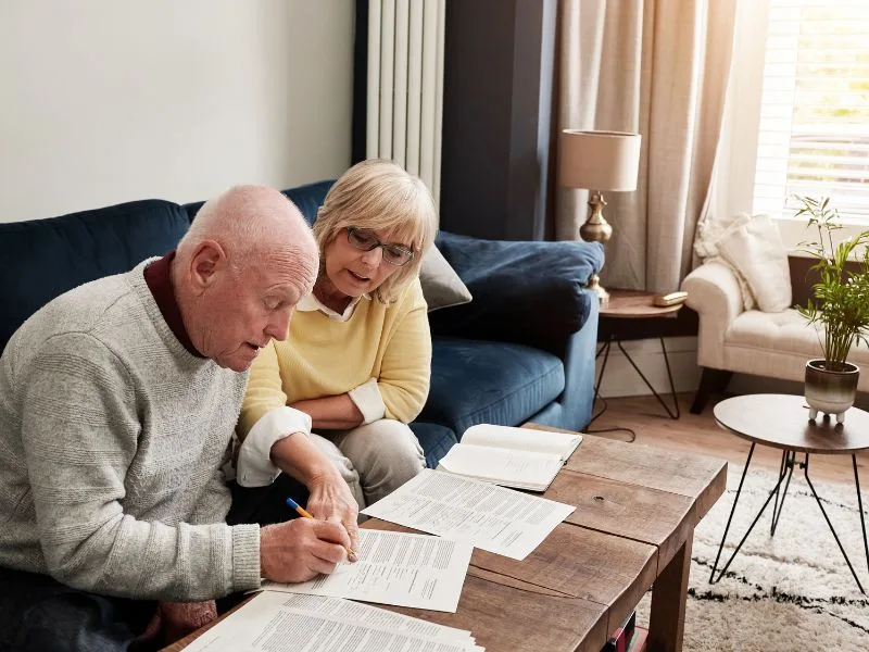 Senior couples filing taxes to claim social security tax deduction for seniors. 