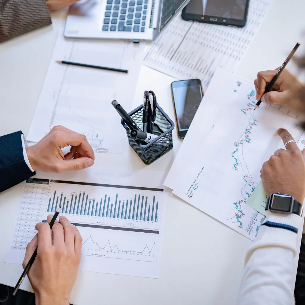 a tax consultant near Raleigh and Durham reviews tax data with a client.